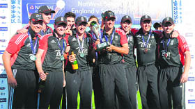 England captain Alastair Cook holds the series trophy after winning the fifth ODI against Sri Lanka at Old Trafford in Manchester on Saturday. 