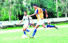 Players in action in a match in the Nemi Dass Memorial District Football League in Dehradun on Monday. 