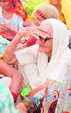 Senior citizens participate in a demonstration organised by the INLD against the delay in distribution of pension in Sirsa 