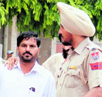 Ex- councillor Ravinder Sabharwal being taken away by the police in Ludhiana on Monday.