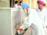 People share one tumbler to drink water at the Sub-Register's (West) office in Ludhiana. 