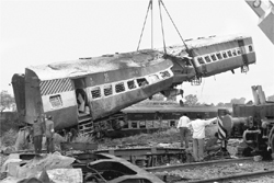 Rescue personnel comb through the wreckage of the derailed Kalka Mail passenger train at Fatehpur in Uttar Pradesh on Monday.