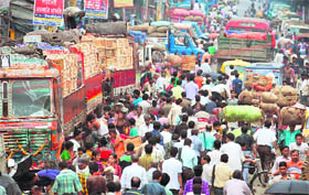BURSTING AT SEAMS: Commuters on a congested street of Kolkata on Monday