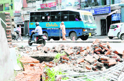A newly constructed boundary wall that fell at Darshan Lal Chowk in Dehradun