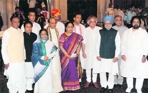 President Pratibha Patil and Prime Minister Manmohan Singh pose for a group photo with the new ministers during a swearing-in ceremony at the Rashtrapati Bhavan in New Delhi 