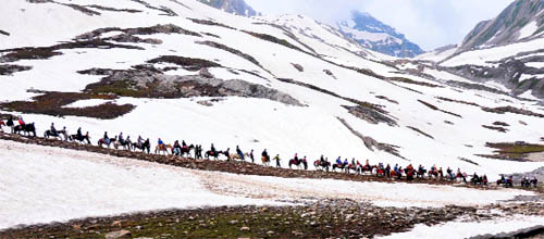 Pilgrims move cautiously on a narrow trek on the way to the Amarnath cave shrine. 