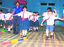 Students of the primary section of BCM Arya Model Senior Secondary School play games in the school. 
