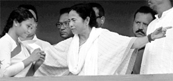 West Bengal Chief Minister Mamata Banerjee felicitates a girl during her administrative rally at Jhargram district on Tuesday