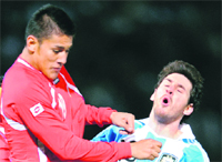Argentines Lionel Messi (R) is marked by Costa Rican Oscar Duarte during their Copa America match in Cordoba on Monday