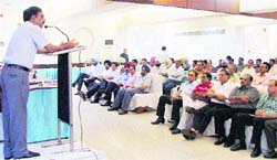 Excise and Taxation Commissioner (ETC) A Venugopal addresses a gathering during a meeting of Apex Chamber of Commerce and Industry in Ludhiana