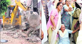Swift action MC officials demolish an illegal structure in the Gurcharan Park area in Ludhiana on Wednesday; and (right) women urge the MC team to spare their house