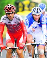The leading men, France's Tristan Valentin (L) and France's Mickael Delage ride in a breakaway during the 167.5 km eleventh stage of the Tour de France