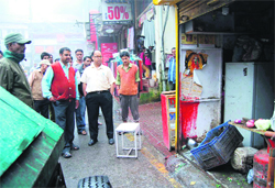 Congress workers hold a demonstration in Dehradun on Thursday