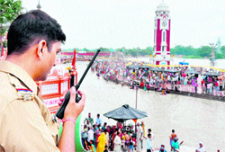 A police official on duty at Brahmkund, Haridwar, on Thursday