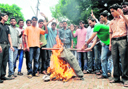 Workers of the ABVP burn an effigy of terrorism in Dehradun on Thursday