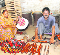 Mangat Ram sits at his little workshop making pakkhi handles and bars manually.