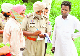 The SHO of Baltoha police station records the statement of the girls family at the Civil Hospital in Ludhiana 