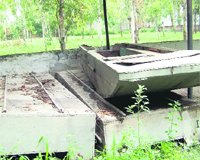 Boats to be used during floods lying broken in a village near Sidhwan Bet. 