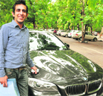 Hardeep poses with his BMW near the RLA office at Sector 17 in Chandigarh on Friday. 