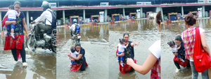 A woman with her child escapes injuries as she is helped out by a passer-by. She fell into an invisible open manhole at the waterlogged entrance of the Welcome Metro station in East Delhi on Friday