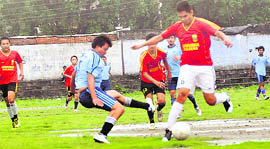 Players in action in a match in the Lala Nemi Dass Memorial Football League at the Pavilion grounds in Dehradun 