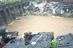Jhuggis built on the banks of the Rispana in Dehradun