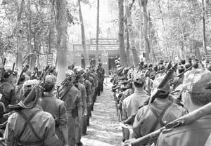 Armed Maoist cadres attending a party meeting somewhere in the forest