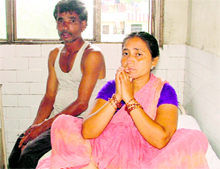 Naresh and Shanti Devi, parents of a 15-year-old girl who set herself on fire, wait at the Civil Hospital in Ludhiana on Saturday