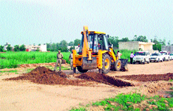 GLADA officials dig the road of an unauthorised colony in Ludhiana