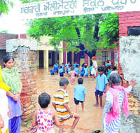 The flooded premises of the primary school at Parao village, near Rajpura. 