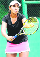 Sanya Madan prepares to serve during the CLTA-AITA Chandigarh Open 50K Men and Women Tennis Tournament at CLTA complex in Chandigarh 