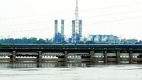 The Yamuna level rises after water is released from Haryana in New Delhi on Sunday. 