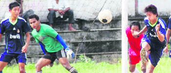 A match in progress in the Lala Nemi Dass Memorial District Football League at the Pavilion grounds in Dehradun 