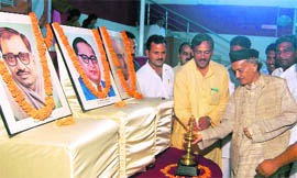 Former state Chief Minister Bhagat Singh Koshiyari lights a traditional lamp at a BJP function in Dehradun on Sunday. 