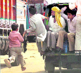 This child might be enjoying this road run in Nuh (Mewat), holding his friends hand but he surely is putting his life to great risk.