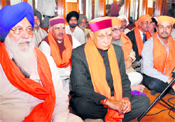Chief Minister Prem Kumar Dhumal attends a religious congregation at a gurdwara in Shimla on Sunday