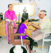 Dr Sanjay Sachdeva examines a patient during a free ENT camp in Kangra on Sunday