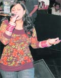 A participant performs during the auditions of the World Karaoke Championship in Ludhiana