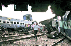 Mangled coaches of the Kalka Mail after its engine derailed at Fatehpur, some 150 km south of Lucknow, on July 10. As many as 35 persons were killed in the mishap
