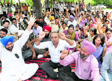 Members of the Employees Welfare Association of the Punjab Health System Corporation (PHSC) protest against the Punjab Government in front of the PHSC office at phase VI in Mohali on Sunday