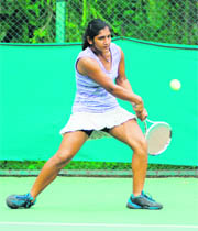 Tarannum Handa plays a backhand return during a match at Sector 10 in Chandigarh 