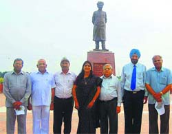 (From left) VCs - ML Ranga, HS Chahal, Mohinder Kumar, Pankaj Mittal, KC Bhardwaj, DDS Sandhu and RP Hooda - stand near the statue of Deenbandhu Chhotu Ram at Murthal.