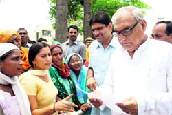 Chief Minister Bhupinder Singh Hooda redresses public grievances at Rohtak on Monday. 