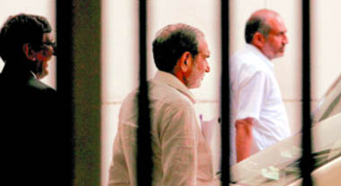 Congress leader Sajjan Kumar (C) leaves after appearing in a court in connection with the 1984 riots case, in New Delhi on Monday.