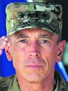 Gen David Petraeus salutes during the change of command ceremony in Kabul