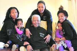Former South Africa president Nelson Mandela with family members at his hometown in Qunu