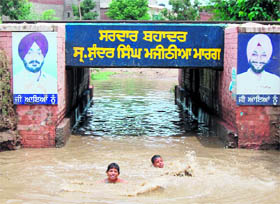 A waterlogged underpass at Jaura Phatak has become a swimming pool in Amritsar.