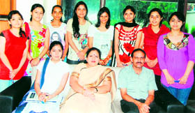 Bachelor of multimedia students of the BBK DAV College for Women, who bagged top positions in Guru Nanak Dev University, pose for a picture with their teachers in Amritsar.