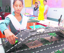 A schoolgirl demonstrates a model during the ‘Inspire Award Science Exhibition’ at Phase 1 in Mohali on Tuesday. A total of 88 middle schools and 49 high schools participated in the event
