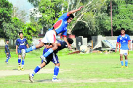 Players in action in a match in the Lala Nemi Dass Memorial District Football League at the Pavilion grounds in Dehradun on Tuesday.